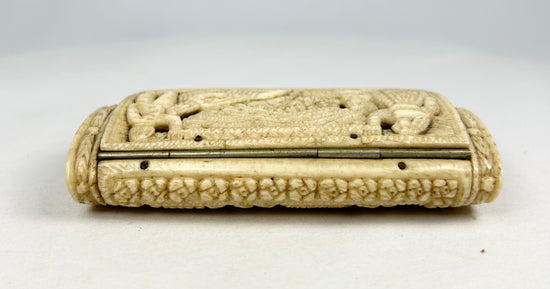 Opposite side of a Napoleonic POW carved bone snuff box featuring carved borders and hinge details on a white background.