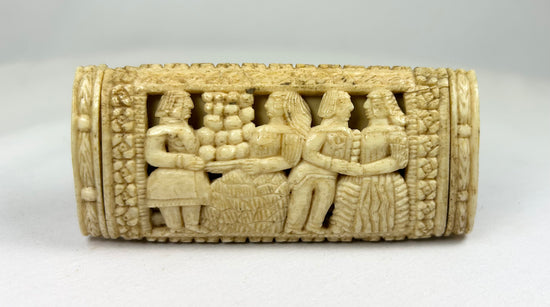 Napoleonic POW carved bone snuff box reverse panel displaying multiple standing figures in relief with lattice and floral borders.