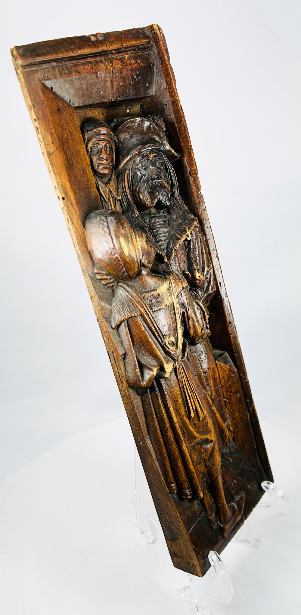 Antique oak architectural panel displaying Gothic/Tudor craftsmanship and expressive carved figures