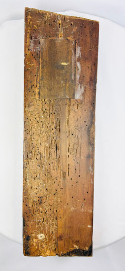 Back angle of the aged surface patina and carved drapery on a 400-year-old Tudor oak panel.