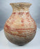 Pre-Columbian globular vessel with a broad flaring mouth