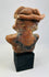 Back of ancient terracotta seated figure with original mineral patina.