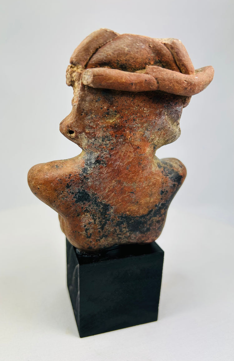 Back of ancient terracotta seated figure with original mineral patina.