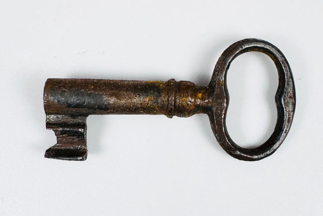Early European sliding-bar lock with three mounting staples and suspended lock body