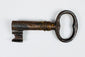 Early European sliding-bar lock with three mounting staples and suspended lock body