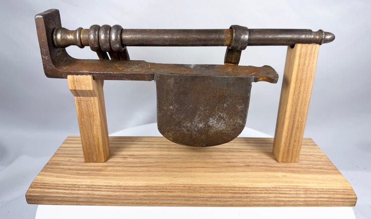 Detailed antique iron lock assembly with dark brown patina and hand-forged surfaces