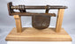Detailed antique iron lock assembly with dark brown patina and hand-forged surfaces