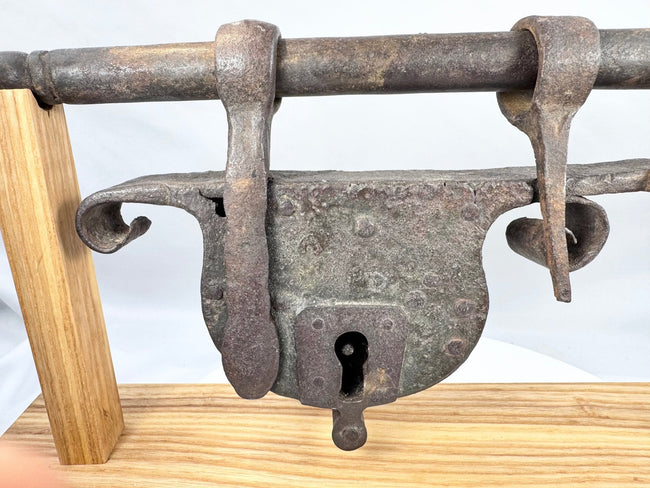 European wrought-iron sliding hasp lock with multiple forged loops and retainers
