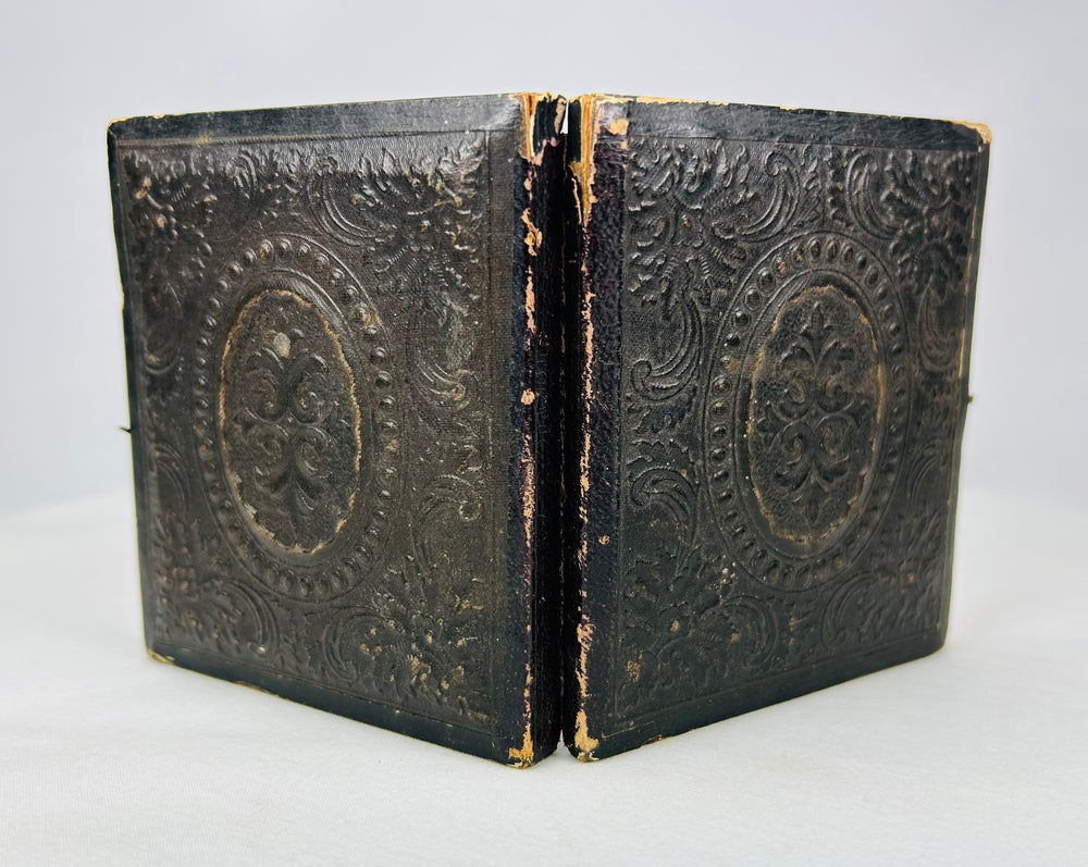 19th-century embossed leather ambrotype case with floral and oval medallion design