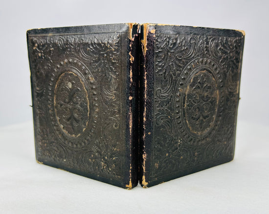 19th-century embossed leather ambrotype case with floral and oval medallion design