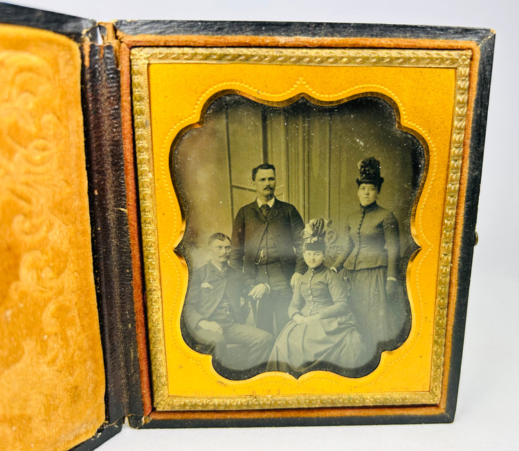 Ambrotype portrait of a Boston family from the 1860s in a yellow velvet-lined case