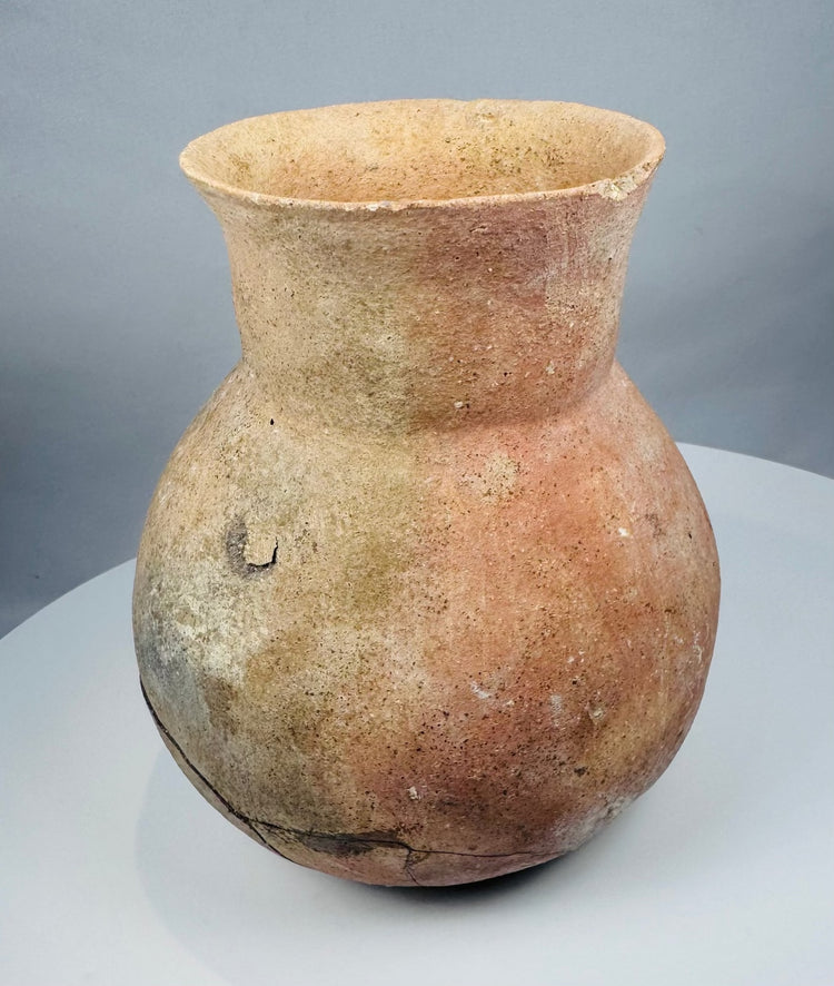 Archaeological Central American ceramic jar with mineral deposits and surface abrasions
