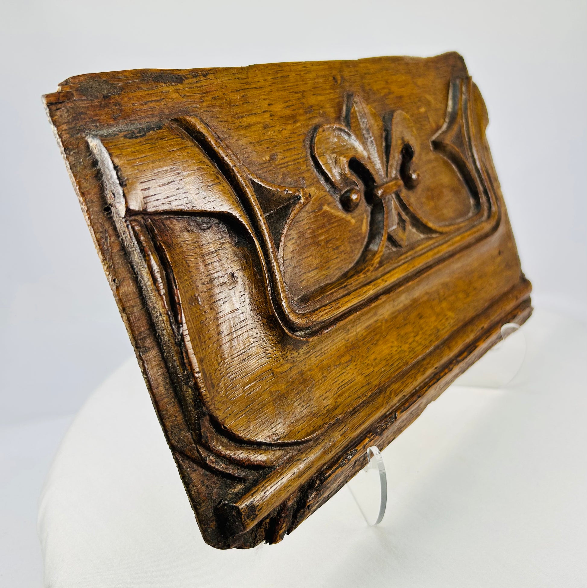 Side perspective of 16th-century carved oak panel with Gothic tracery
