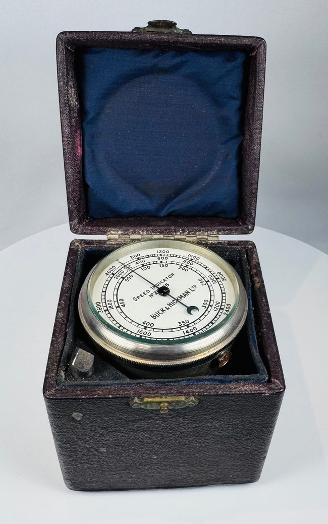 Antique engineering tachometer with glass-covered circular dial