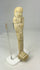 Angled side view of an Egyptian ushabti showing faint traces of pigment