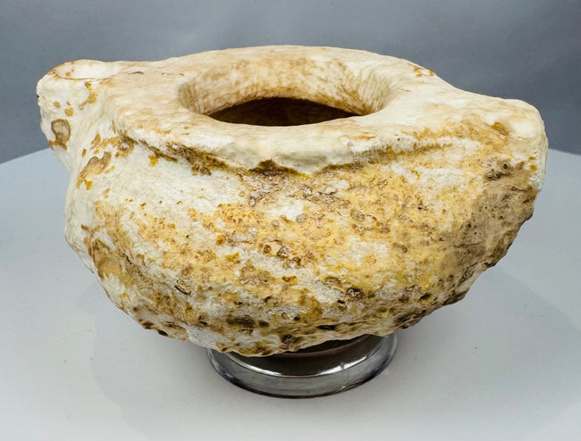 Low-profile Middle Eastern stone container with deeply carved cavity