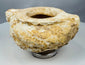 Low-profile Middle Eastern stone container with deeply carved cavity