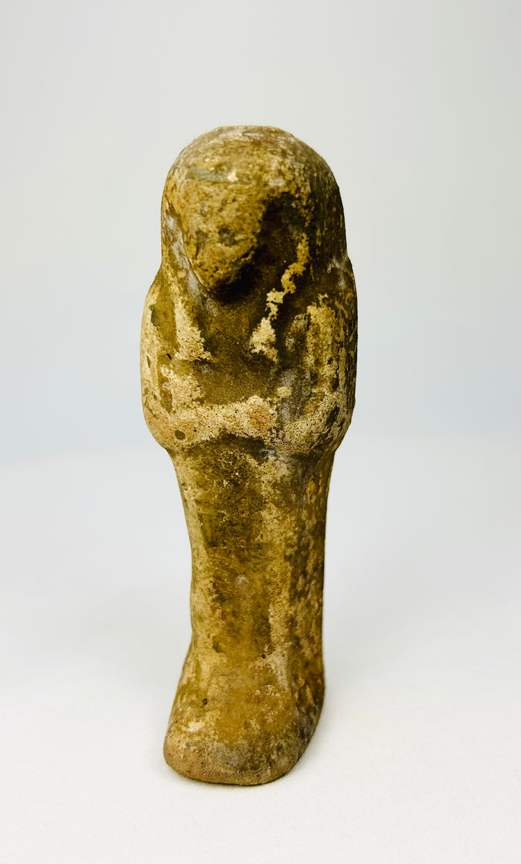 Weathered sandstone ushabti statue standing upright for product photography.