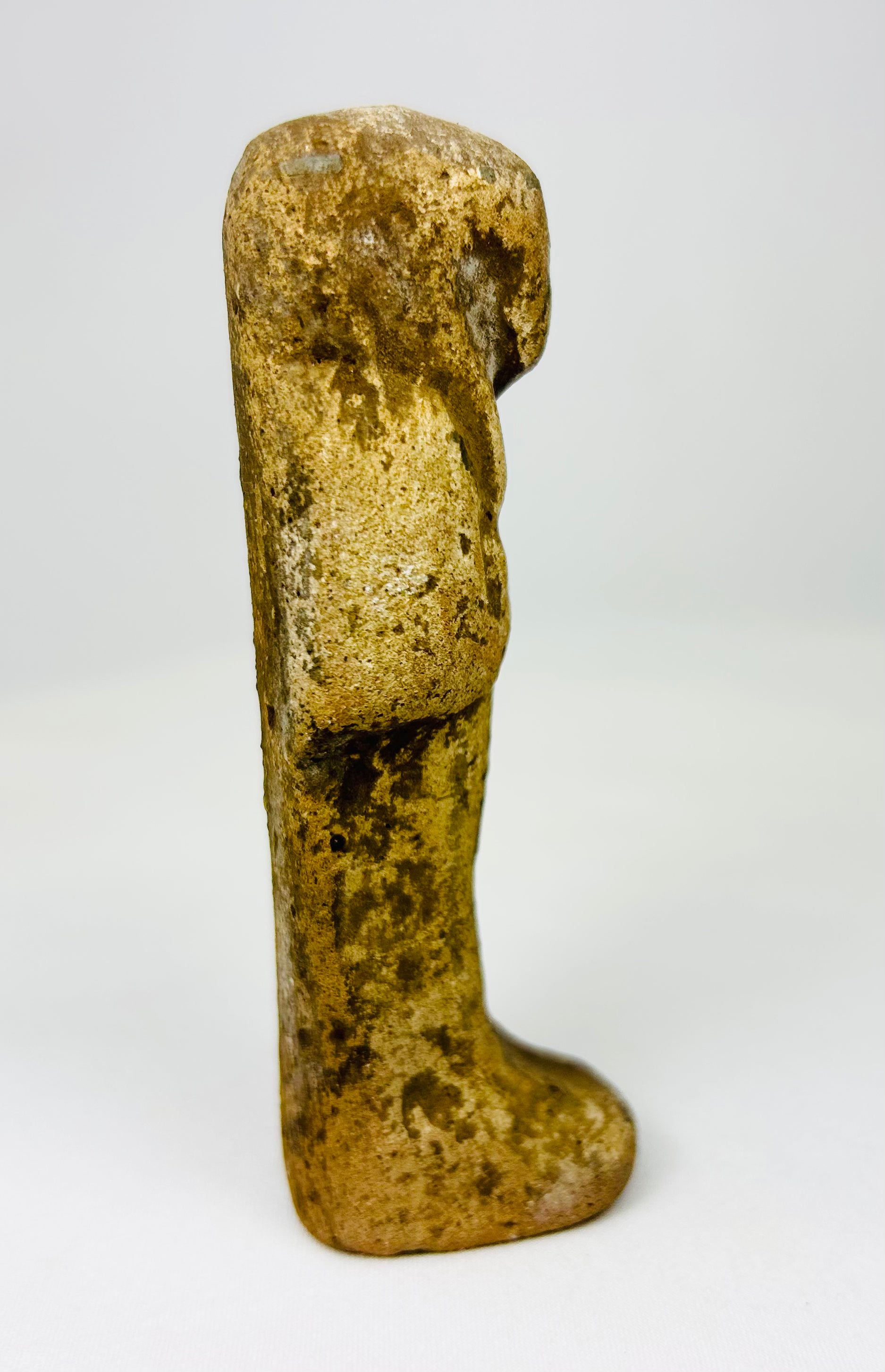 Sandstone ushabti figurine from Egypt with visible pigment traces.