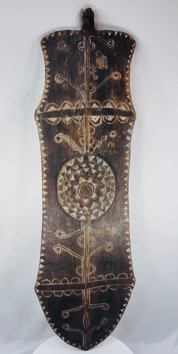 Large early 20th-century African wooden shield with white-pigmented incised patterns