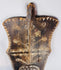 Side profile of the large African ceremonial shield showing its carved form and rear handgrip