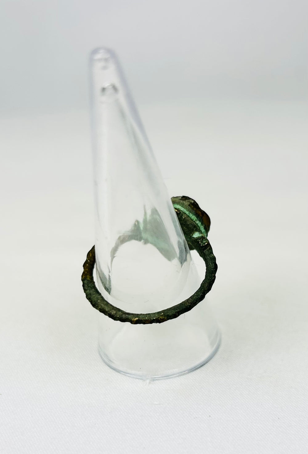 Ancient wearable bronze ring showing oxidation and timeworn features
