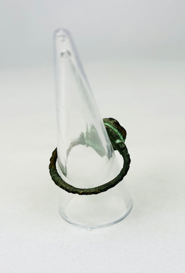 Ancient wearable bronze ring showing oxidation and timeworn features