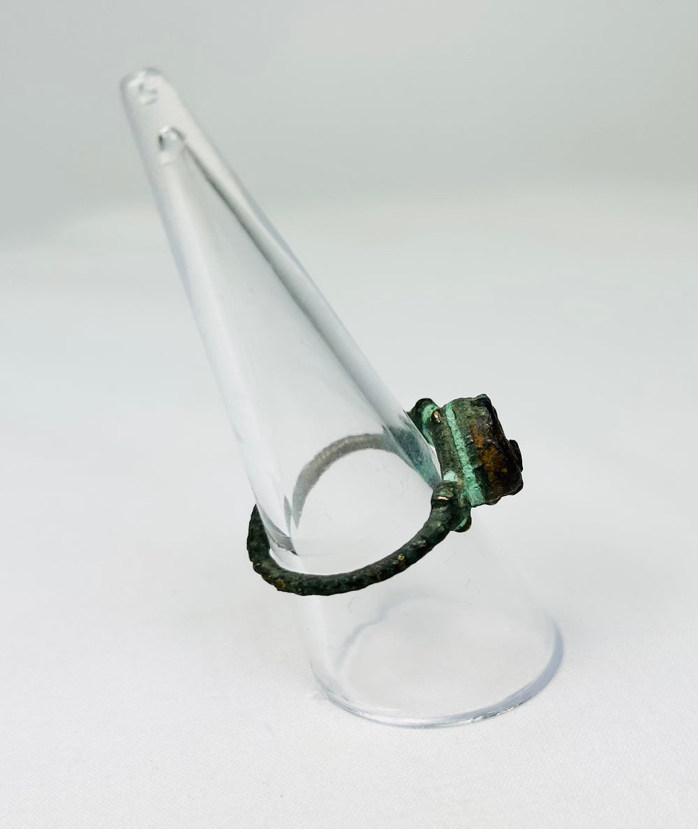 Historic bronze ring with natural patina photographed for cataloging