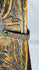 Oxidized iron strap latch mounted on a traditional carved wooden cabinet