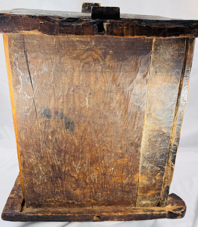 Antique wooden chest displaying pegged joints and hand-worked construction