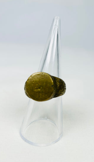 Roman Provincial bronze ring with engraved scroll motifs, white background