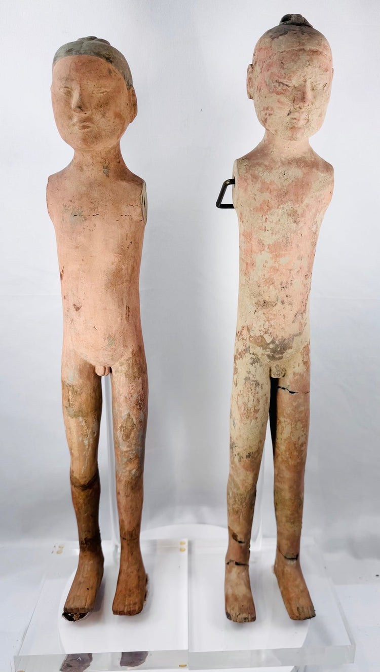 Ancient Chinese terracotta attendants displayed together on clear acrylic stands