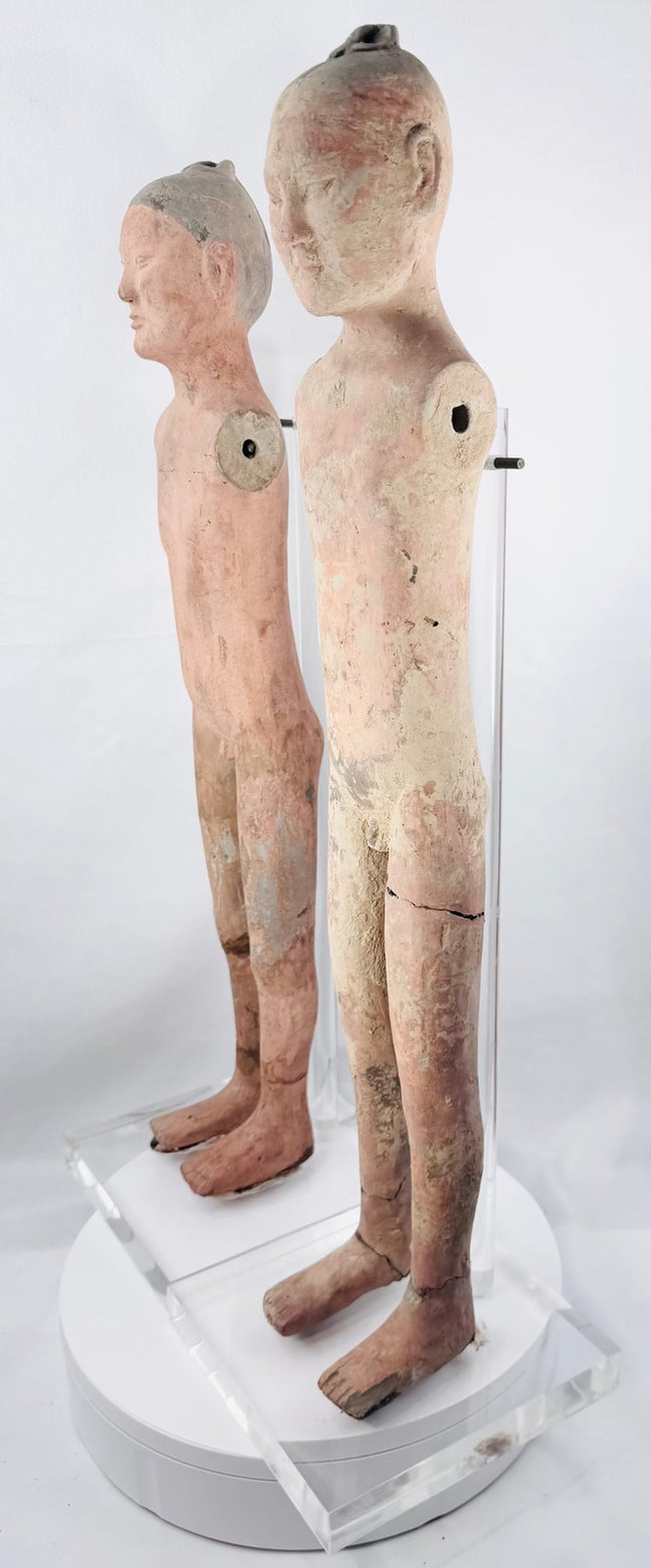 Salmon-pink Han Dynasty tomb attendant with dark gray painted hair and topknot