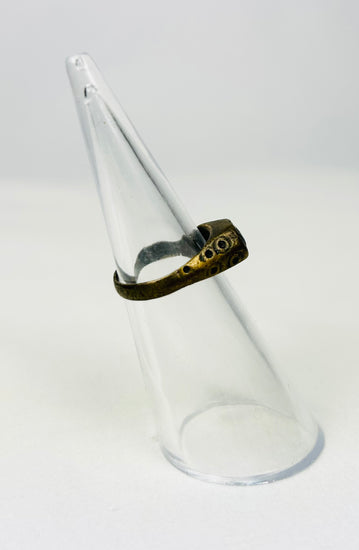 Byzantine-era brass ring photographed on white backdrop