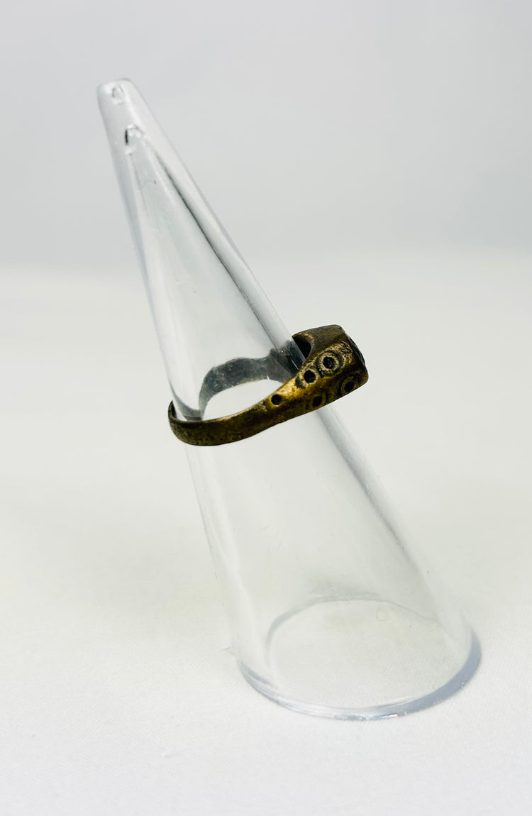 Byzantine-era brass ring photographed on white backdrop