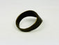 Angled view of antique thumb ring on white background