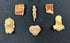 Assortment of Pre-Columbian figurines and ceramic relics mounted inside a display case