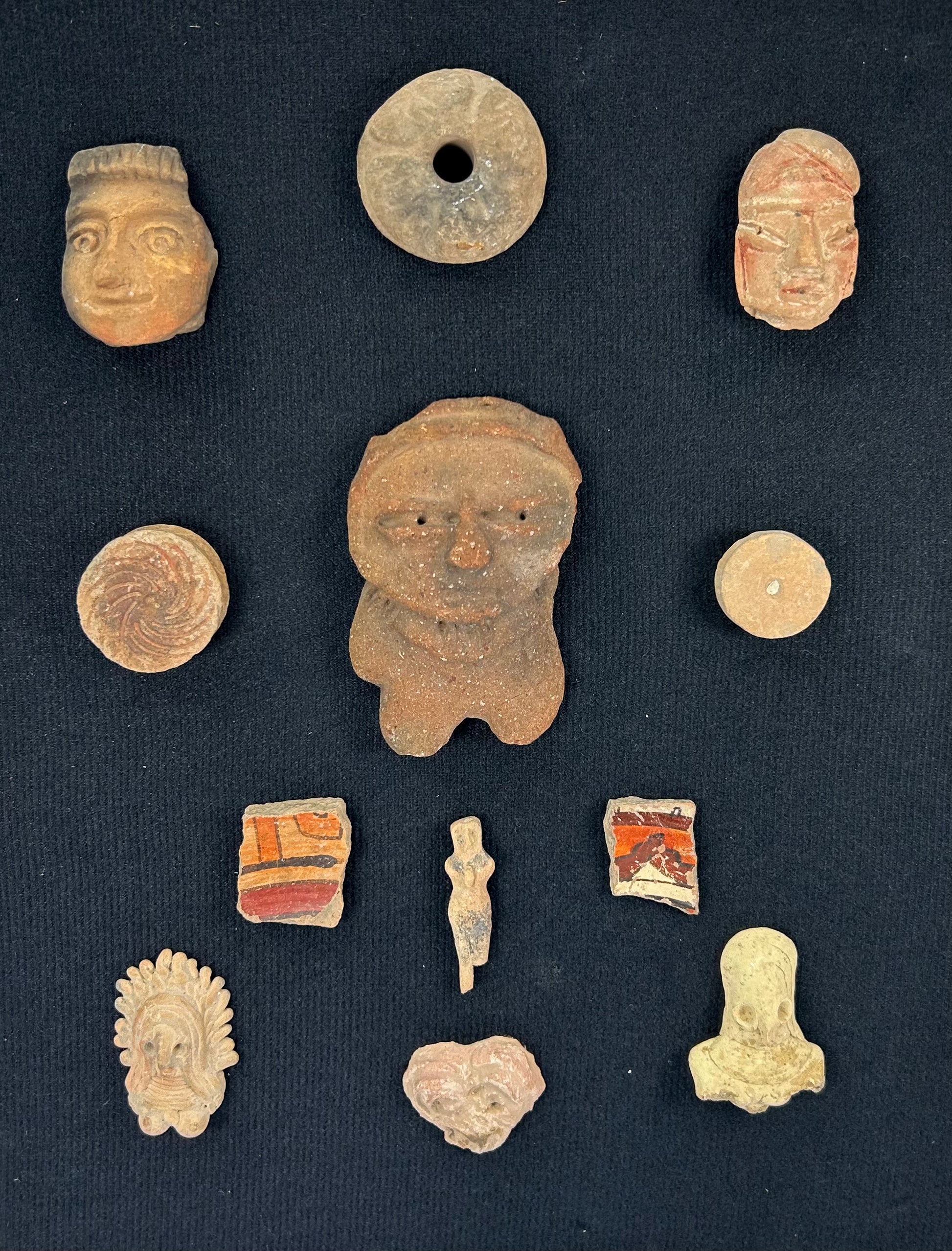 Curated collection of Pre-Columbian cultural artifacts displayed for preservation