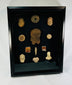 Grouped ancient ceramic fragments and figurines from Central Mexico in a shadowbox