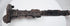 Close-up of the upper blade and hilt of a Luristan iron short sword, displaying corrosion and patina consistent with significant age.