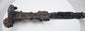 Close-up of the upper blade and hilt of a Luristan iron short sword, displaying corrosion and patina consistent with significant age.