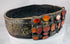 Detailed view of the pierced brass plates and riveted fittings on a historic Jewish wedding belt from Eastern Europe.