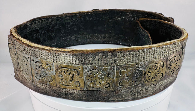 Historic Southern Russian wedding belt displaying repeating geometric brass elements and polished orange Cornelian cabochons.