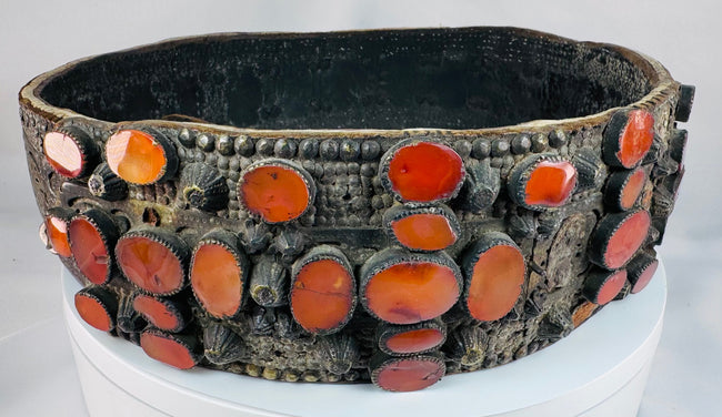 17th–18th century Jewish bridal belt from Southern Russia featuring pierced brass plates and rows of orange Cornelian gemstones.