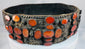 17th–18th century Jewish bridal belt from Southern Russia featuring pierced brass plates and rows of orange Cornelian gemstones.