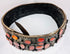 Circular view of an antique Eastern European bridal belt showing its substantial brass construction and continuous rows of Cornelian stones.