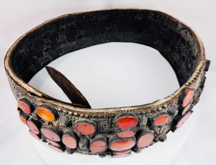 Circular view of an antique Eastern European bridal belt showing its substantial brass construction and continuous rows of Cornelian stones.