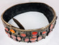 Circular view of an antique Eastern European bridal belt showing its substantial brass construction and continuous rows of Cornelian stones.
