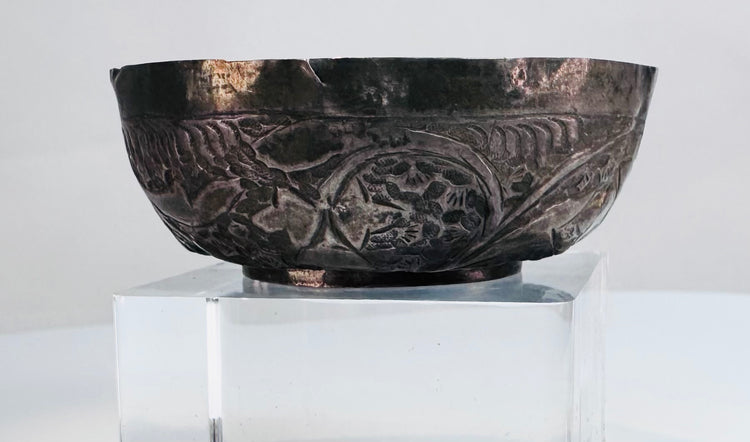 Small Persian silver bowl from the Seljuk period, traditionally associated with storing precious oils, ointments, or perfumes.