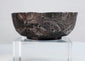 Medieval Islamic silver unguent bowl with detailed floral and geometric motifs decorating the exterior surface.